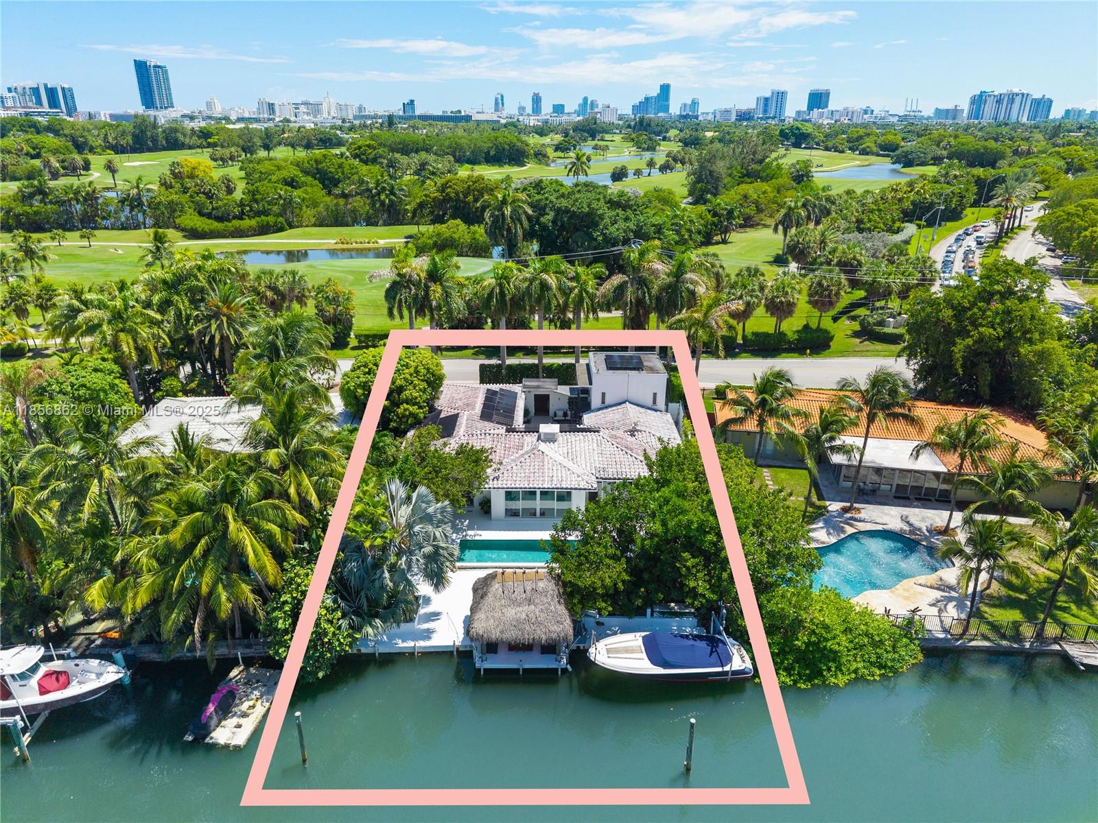 OVERSIZED WATERFRONT HOME WITH 80FT OF WATERFRONTAGE & GOLF COURSE VIEWS IN THE HEART OF MIAMI BEACH! Ideal to live in while you plan for a Renovation or Newly Constructed Residence. The Current Home features 3 Beds + 3.5 Baths + Open Office area. 3,576 SF of Interior on a large 10,343 SF LOT across Miami Beach Golf Course w/80 FT on Water. Private Courtyard w/Covered Lounge area & a Spiral Staircase to the Upper Level Guest Bedroom Suite w/Golf Course Views. Living & Dining Areas flooded w/Light Overlooking the Spacious Backyard Wrapped in Lush Greenery w/Pool, Waterfront Tiki Lounge + Private Dock. Kitchen in Neutral Tones w/Granite tops + Extensive Storage Space. Contemporary Primary Suite w/Sliding Glass Doors Opening to a Private Outdoor Lounge. Rooftop Solar Panels & 2-Car Garage.