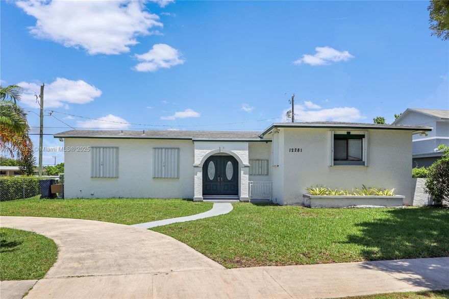 Experience the perfect blend of style and convenience in this charming corner-lot home! Enjoy a modern, updated kitchen and baths, featuring sleek quartz countertops and new cabinetry. Wood-like flooring throughout provides a seamless flow and easy maintenance. There is a new AC system and new PVC piping. A full-termite tenting was completed, and a transferable termite warranty has just been renewed. Step outside to a private backyard oasis with a covered screened patio, perfect for entertaining or relaxing. The included shed offers extra storage space for all your tools and toys. With a circular driveway providing ample parking and convenience, and hurricane shutters for peace of mind, this home is as practical as it is beautiful. Don't miss your chance to own this move-in-ready gem!