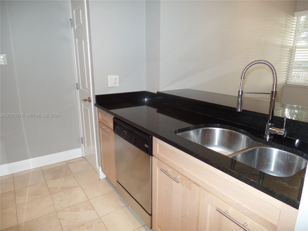 Photo of 2881 N Oakland Forest Dr #112, Oakland Park, FL 33309 (MLS # A12025578)