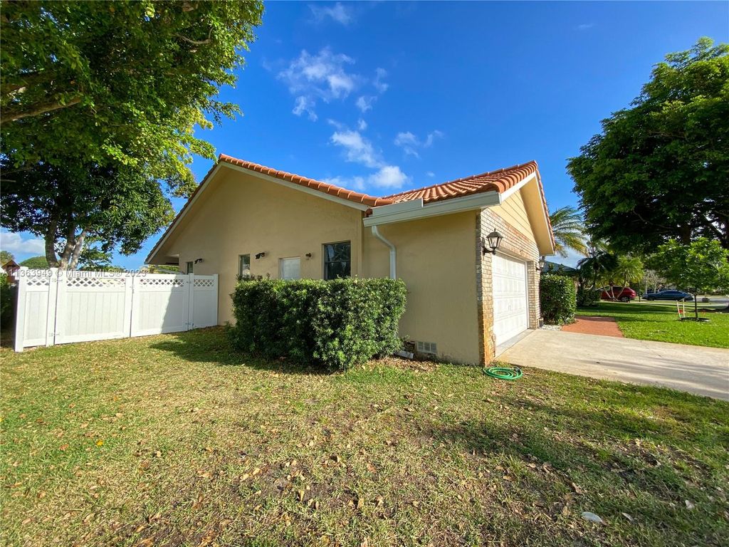Photo of 4033 NW 73rd Ave, Coral Springs, FL 33065 (MLS # A11363949)