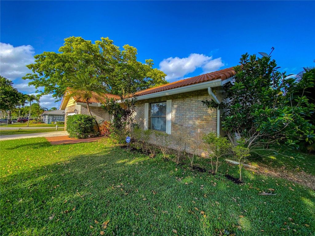 Photo of 4033 NW 73rd Ave, Coral Springs, FL 33065 (MLS # A11363949)