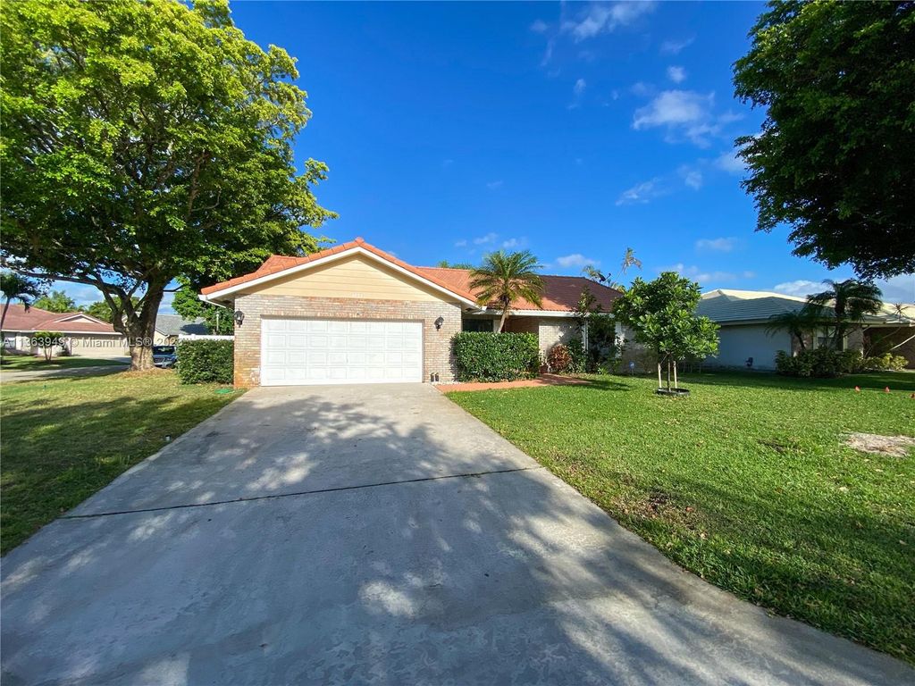 Photo of 4033 NW 73rd Ave, Coral Springs, FL 33065 (MLS # A11363949)