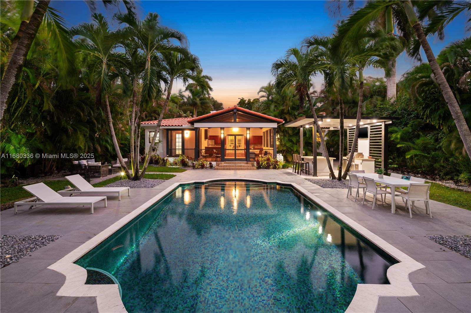 This turn-key 1940's Art Deco style home has a back yard entertaining space to rival the finest Caribbean resorts with a huge, screened party room (built in 2009), oversized salt-water pool, custom Paradise Grill summer kitchen, 164' deep lot with gorgeous privacy landscaping and more! There is a large entry foyer and den/office, 28' long main living room with high Art Deco tray ceilings and wood burning fireplace, primary bedroom (15'x23') has 2 large walk-in closets & a spacious bath, 2nd bedroom is 15' X 11'8", the 3rd bedroom is perfect nursery or office size at 16'3 X 8'4", renovated kitchen, wood floors, impact doors & windows throughout, garage, circular driveway, top Gables neighborhood withing walking distance to the Granada GC. 20-minute Uber ride to Miami International Airport.