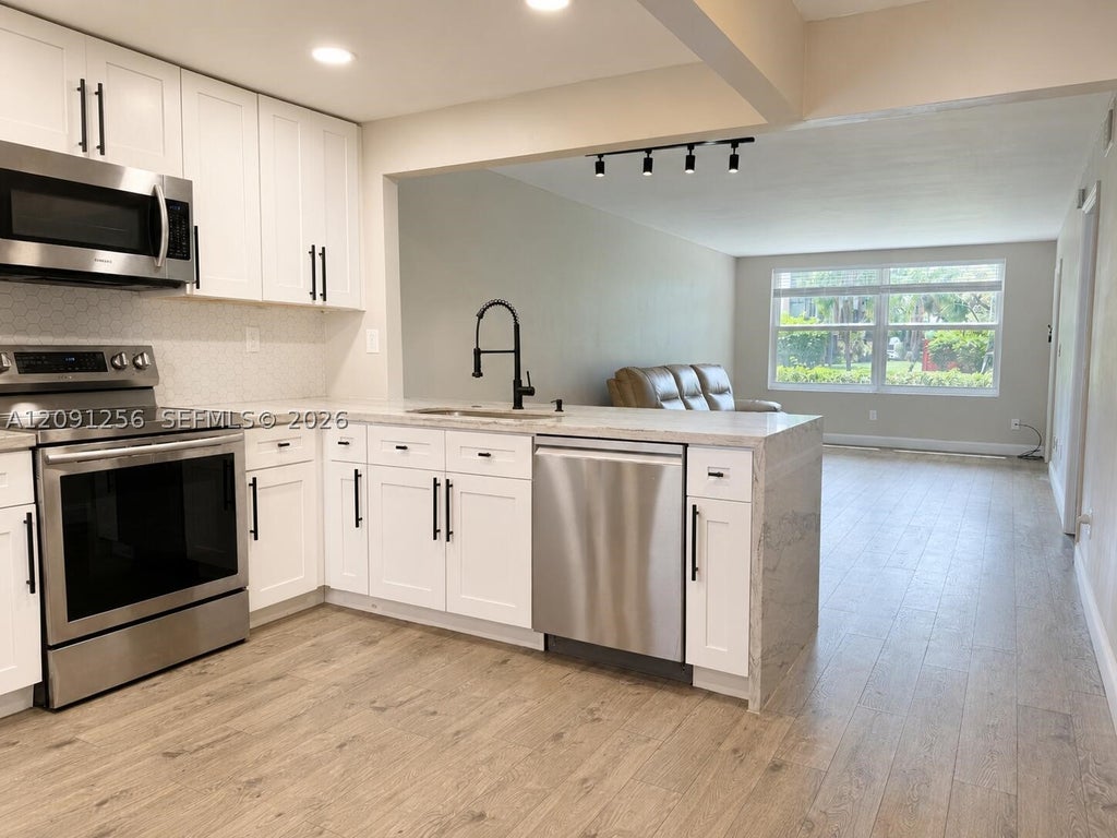 Photo of 1701 NW 75th Ave #104, Plantation, FL 33313 (MLS # A12091256)
