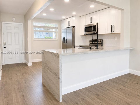 Photo of 1701 NW 75th Ave #104, Plantation, FL 33313 (MLS # A12091256)