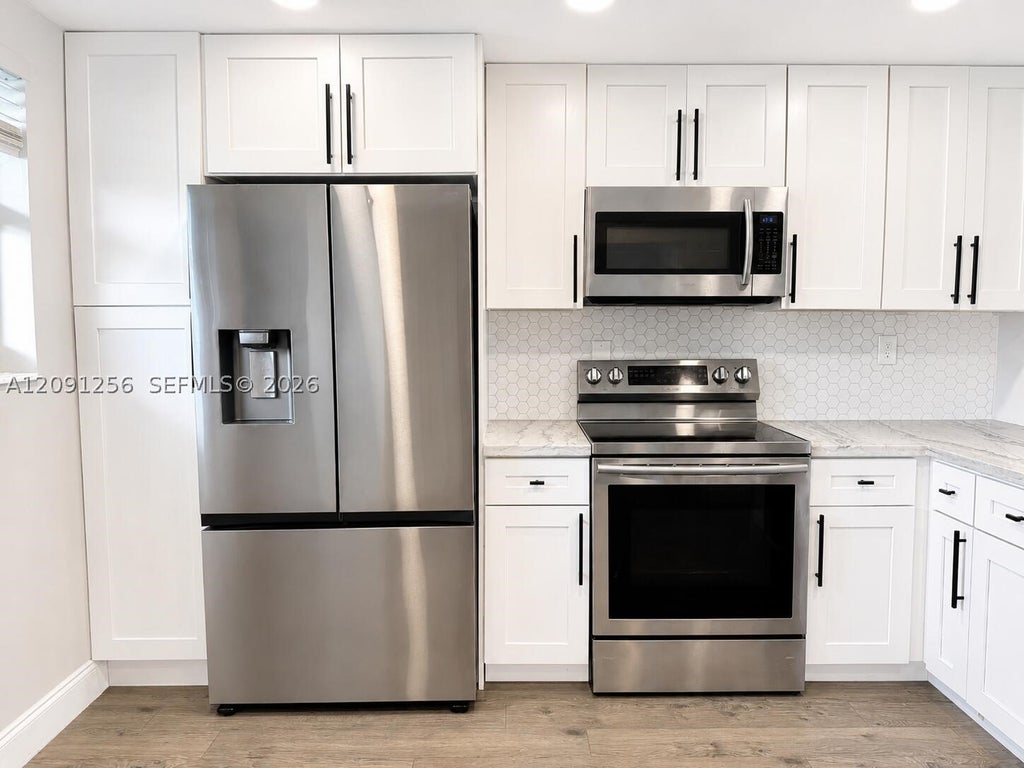 Photo of 1701 NW 75th Ave #104, Plantation, FL 33313 (MLS # A12091256)
