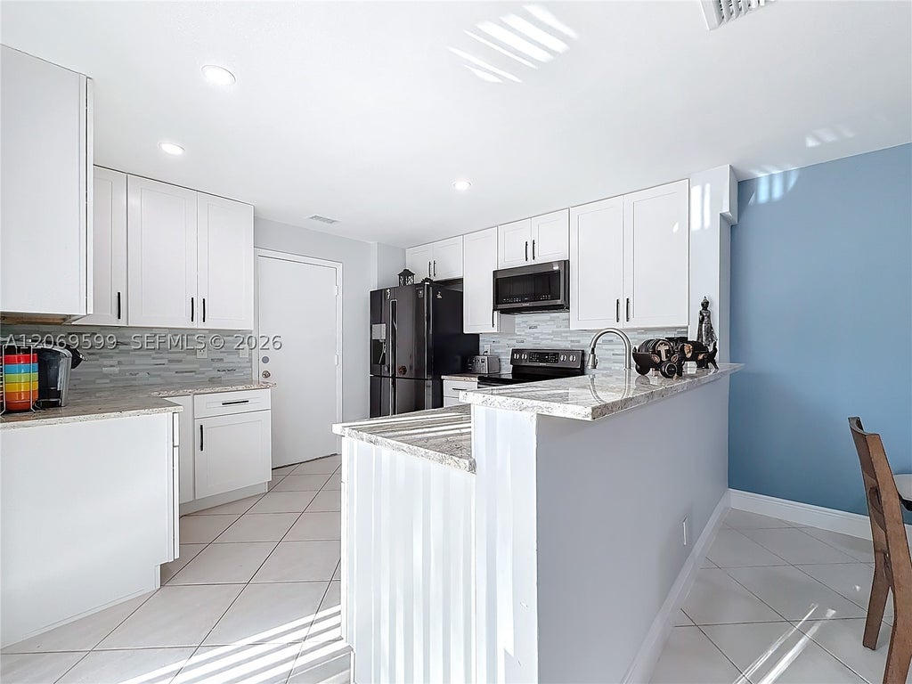 Photo of 10977 Long Boat Dr #10977, Cooper City, FL 33026 (MLS # A12069599)