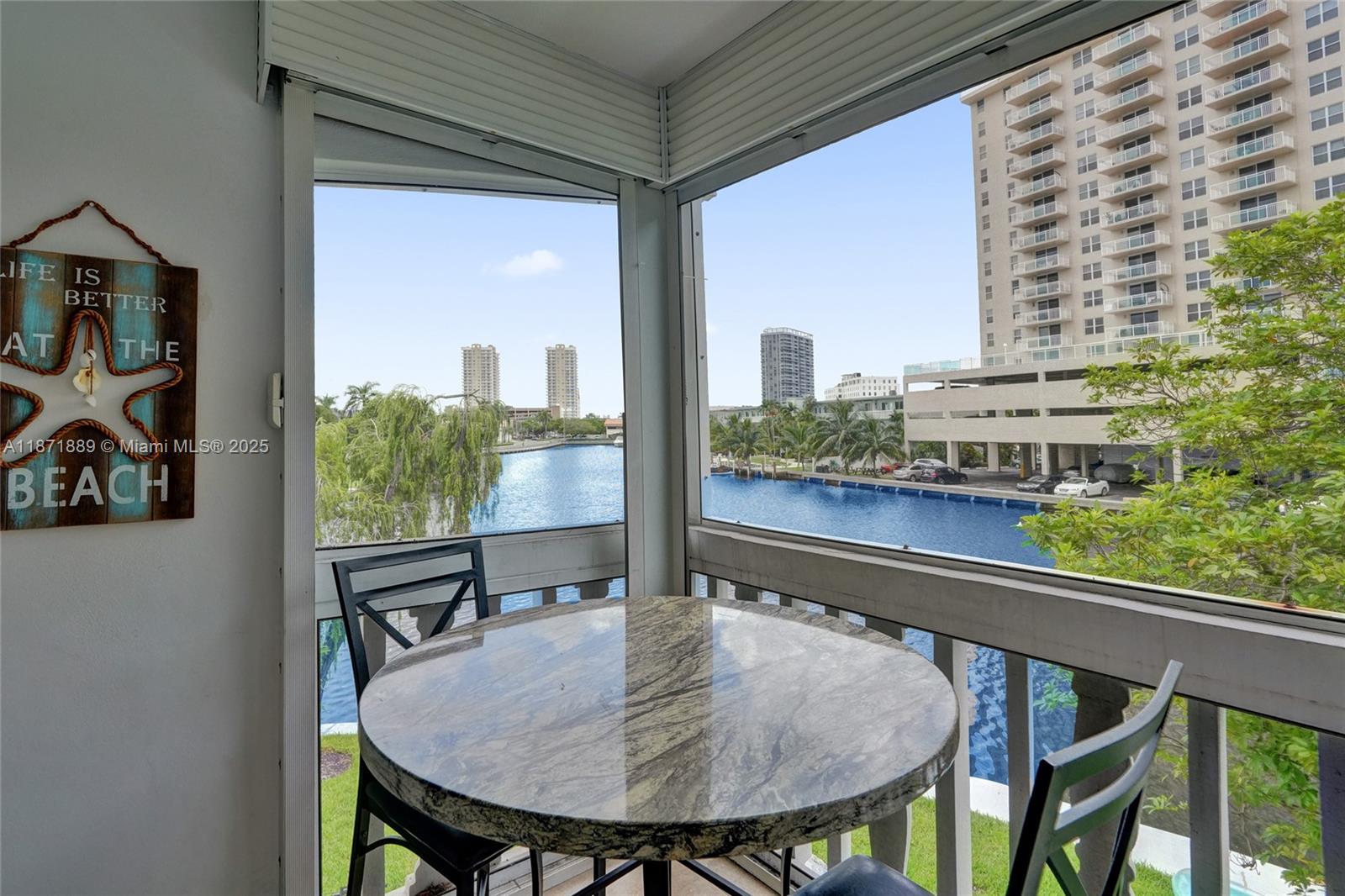 Corner unit on the 2nd floor with a screened balcony showcasing gorgeous Intracoastal views, close to the beach. Welcome to the desirable Isle of Paradise! ALL AGES co-op community offering peaceful island-style living surrounded by water. This beautifully maintained 2-bedroom 2-bath residence is fully furnished and move-in ready, featuring an upgraded kitchen with elegant granite countertops and stainless steel appliances. The community provides amenities including a pool, shuffleboard, and clubhouse. Perfectly located in Hallandale Beach, just minutes from the ocean, and ideally situated between Fort Lauderdale and Miami. Close to shopping, fine dining, entertainment, and nature parks—everything you need for the ultimate South Florida lifestyle!