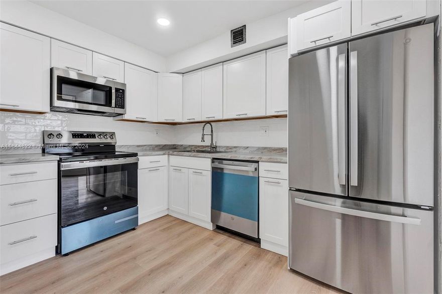 Discover this magnificent, spacious 2-bedroom, 2-bathroom corner unit, offering stunning views from the living room and master bedroom, including breathtaking sunsets. Recently remodeled, this condo features a sleek, modern kitchen with brand-new stainless-steel appliances, a new water heater, and updated bathroom vanities. Enjoy contemporary flooring throughout, new blinds new light fixtures, and a freshly painted interior. The master bedroom includes a walk-in closet, and the unit boasts ample storage space. Experience fabulous amenities such as 24-hour security, tennis courts, a lush tropical pool, a clubhouse, and a library. Located in an excellent area close to shopping and dining, this condo offers vibrant South Florida living at its best. Don’t miss this ideal opportunity!