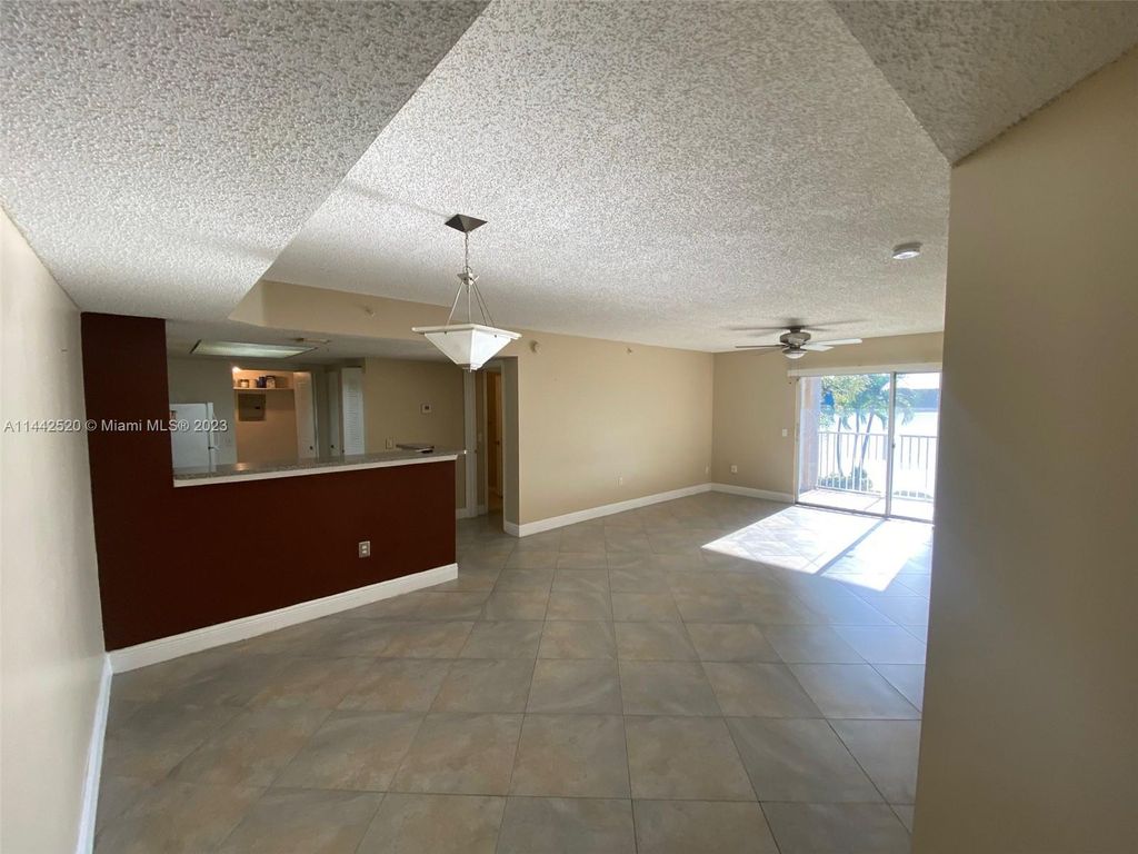 Photo of 5055 Wiles Rd #206, Coconut Creek, FL 33073 (MLS # A11442520)