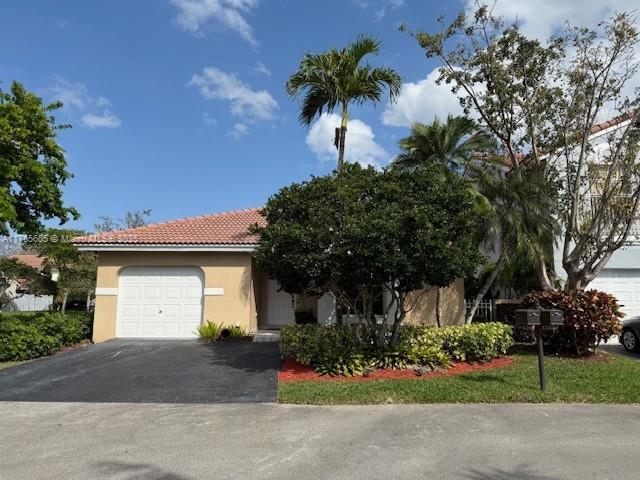 This very well maintained 2-bedroom, 2-bathroom home is located in the community of Garden Homes at Country Isles in Weston. The vaulted ceilings and the bay windows give the living and kitchen areas an open and airy feel with a lot of natural light. It features a one car garage that is easily converted for additional living or office space. Stainless steel appliances and durable Corien countertops adorn the kitchen. There is a lovely private patio to enjoy on the side of the house overlooking a manicured side and back yard. Hurricane shutters and some impact windows provide storm protection. The roof was replaced in 2011. Near top-rated schools, parks and shopping centers. Sufficient on-site parking and guest parking conveniently located. Pool and Clubhouse available for residents.