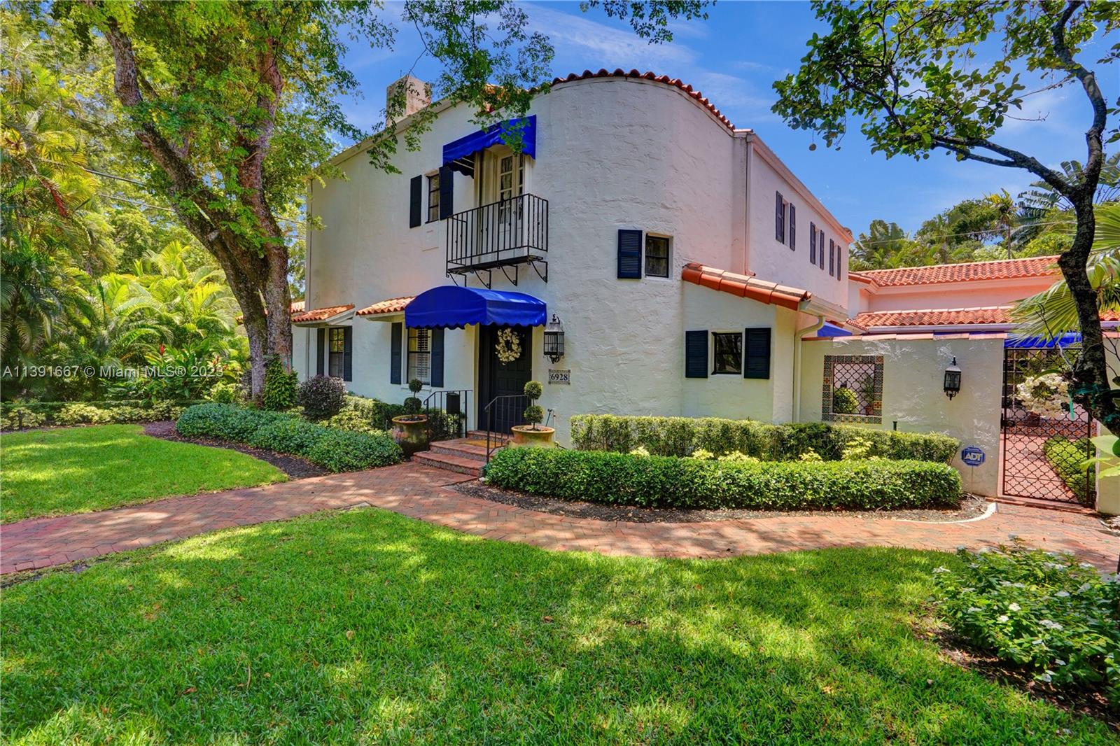 Exquisite 1927 Old Spanish villa nestled in Coral Gables. This home offers 5 bedrooms, 4.5 bathrooms, a library, an office/den, and rests on a 13,789 sq. ft lot. The luxurious primary suite, complete with an office/den and a spacious bath. Entertaining is a breeze with numerous gathering spaces, including a formal living room w/fireplace, a formal dining area, a Florida room, and an interior courtyard. The property also features a refreshing pool and a 2-car garage. Layout comprises the primary suite, additional en-suite bedrooms, a library, and an office/den on the lower level. Upstairs, discover another en-suite bedroom and 2 bedrooms connected by a Jack and Jill bathroom. Listed in the prestigious Coral Gables Register of Historic Places, this home exudes character and timeless appeal.