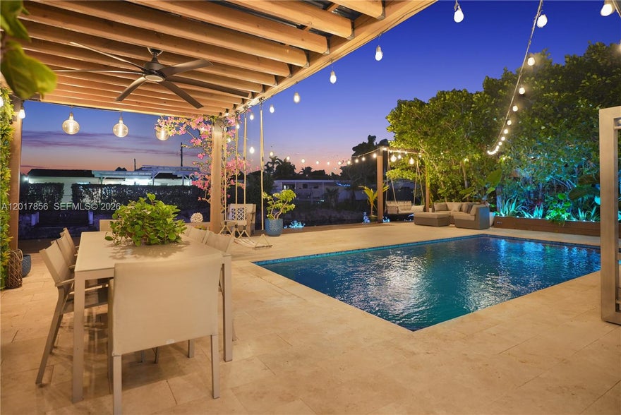 Spectacular single-family pool home featuring 4 bedrooms and 4 bathrooms. Tiled throughout with recessed lighting, this bright and spacious home offers a separate living room and a grand kitchen with top-of-the-line stainless steel appliances, an eat-in island, and abundant cabinet storage. The kitchen overlooks the large family room and dining area, creating the perfect layout for gatherings and comfortable daily living.
The expansive primary suite features a luxurious bathroom with a stand-in shower, jacuzzi tub, and a large custom-built closet. All bedrooms are generously sized and include their own private ensuite bathrooms.
Step outside to your Tulum-inspired backyard oasis featuring a large deck with swings, BBQ grill area, and plenty of space for hosting guests or relaxing while enjoying serene canal views. This home combines comfort, style, and resort-style living in one exceptional property. Prime central location just minutes from shopping plazas, major highways, dining, and more.
