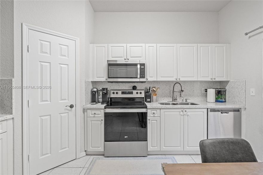 Remodeled 2BD 2.5BA condo in the highly desirable Arbor Park community within Keys Gate Golf and Tennis Country Club, offering easy low maintenance living in a gated, family friendly neighborhood with lush green views.

Updated kitchen with quartz countertops, 2 year old appliances, and a spacious pantry. Tile throughout home, recessed lighting, and abundant natural light. Primary suite features dual sinks, a stand alone tub and shower, and custom closet built ins. Second bedroom is a junior suite with its own bathroom and a private balcony overlooking the garden.

Includes 1 car garage plus 2 driveway spaces, separate laundry room, private fenced patio, covered front porch, and AC coils approximately 1 year old.

Located directly in front of the community pool and playground just a one minute walk, making it ideal for families and everyday convenience.

HOA is $690 per month and includes roof coverage, exterior insurance plus cable and internet, which are usually separate monthly bills. It also includes 24 hour gated security, a resort style pool, playground, tennis courts, and full common area maintenance.

Minutes from A rated public and charter schools, BJ’s, Target, Homestead Baptist Hospital, and just 30 minutes from the Florida Keys.

FHA and Conventional welcome buy with as little as 3% down. Buyer may qualify for down payment assistance up to $14,550.