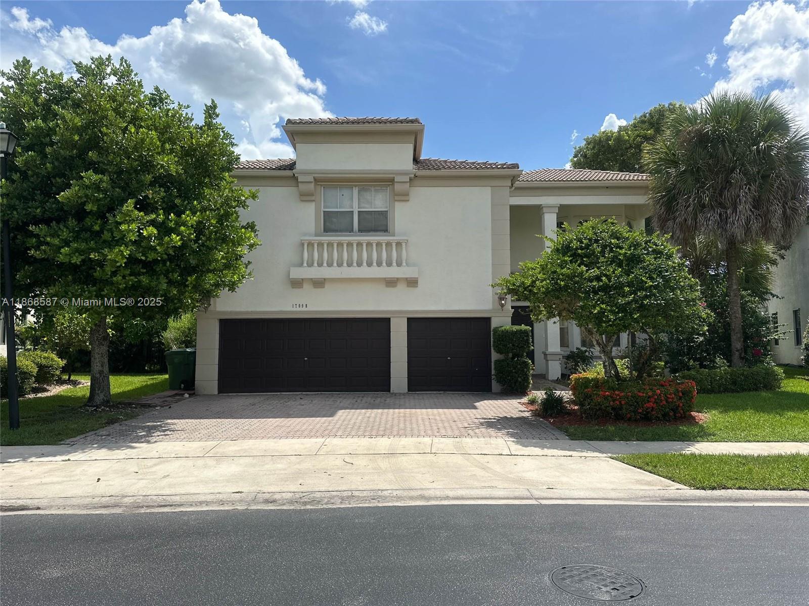 This spacious two story home offers a 6/4 layout with a three car garage and sits on a well-kept corner lot. The interior features cathedral ceilings and an elegant oval staircase that enhances the open design. With its generous floor plan and distinctive details, this property presents a strong option in the market.