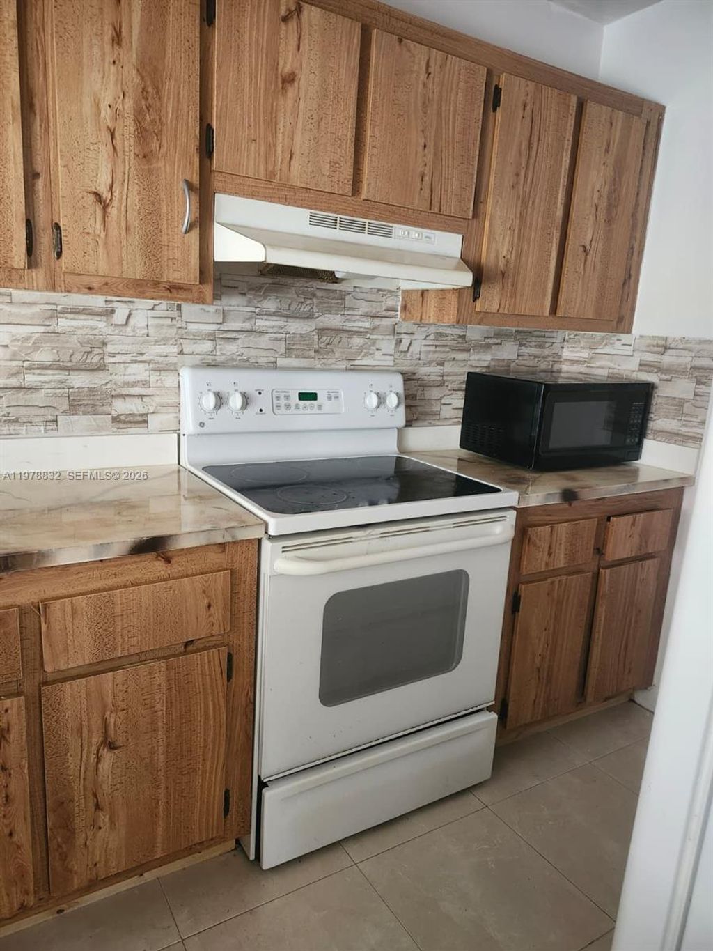 Photo of 10037 Winding Lake Rd #102, Sunrise, FL 33351 (MLS # A11978832)