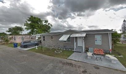 Manufactured home with spacious 3 bedrooms/2 bath. Located in the desirable community of Miami Gardens close to the Hard Rock Stadium. The home features laminate floors, a laundry room. The community features a basketball court, playground, and 3 pools perfect for enjoying the endless Florida summer. GREAT INVESTMENT OPPORTUNITY!! Don't miss out! Call today for an appointment. Sold As-Is