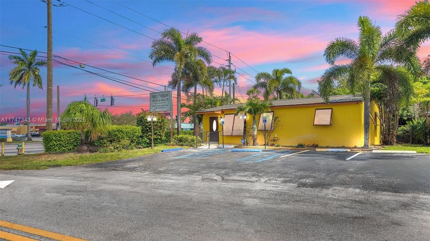 PRIME CORNER FREESTANDING OFFICE BUILDING IN HOLLYWOOD, FL – HIGH VISIBILITY & EXCELLENT LOCATION! This spacious 933 sq. ft. office sits on a 7,866 sq. ft. corner lot, offering maximum exposure and convenience. Features include a metal roof, ADT alarm system with surveillance cameras, sprinkler system, and lush landscaping. The property provides parking for four vehicles, including two ADA spaces. Inside, you'll find three private offices, a large open workspace, a welcoming reception area, an ADA-compliant bathroom, and a kitchen. Ideal for a variety of businesses—don't miss this fantastic opportunity!