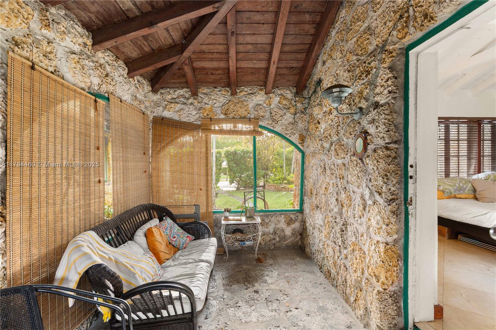 Step into a timeless gem that transcends typical Coral Gables living—this enchanting coral rock community is steeped in local history and architectural charm. Tucked away in a storybook setting, this residence features stunning marble floors, exposed beam ceilings, and a charming front porch perfect for breezy afternoons. The heart of the home is its spectacular GaudÃ-inspired terrace—an artistic escape that blends whimsical design with Mediterranean flair. With updated kitchens and classic details throughout, this is Coral Gables living reimagined with soul, style, and historical significance.