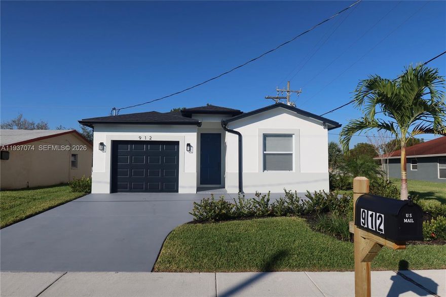 Stunning Modern Home in Riviera Beach! Discover this beautiful, move-in ready 3-bedroom, 2-bathroom home designed for modern living and functionality. Featuring an 8-foot entry doorway, wood plank tile flooring throughout, impact windows, and gutters, this home combines style, comfort, and durability. The open-concept kitchen and family room create a spacious, inviting atmosphere, perfect for entertaining or relaxing. The kitchen boasts custom cabinetry, stainless steel appliances, and high-hat lighting throughout, adding a touch of elegance and sophistication. Enjoy the additional 16x16 side patio on the oversized lot ideal for outdoor gatherings or creating a personal oasis. Plus, the property offers potential for an ADU, giving you future flexibility and added value. Don’t miss the opportunity to make this modern Riviera Beach gem yours today!