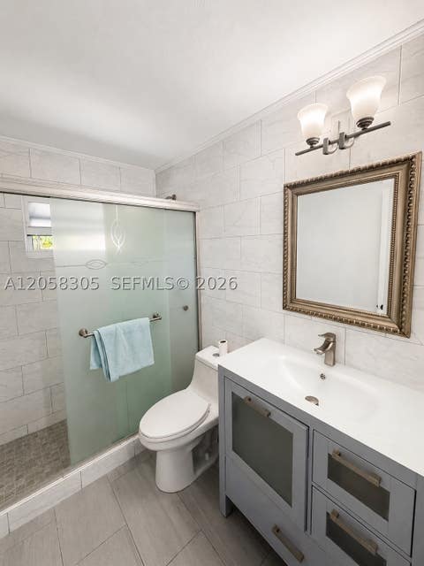 Tiny photo for 5651 NE 9th Ave, Oakland Park, FL 33334 (MLS # A12058305)