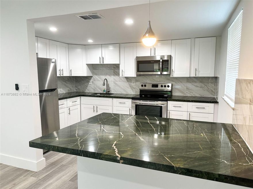 Unit 1 -  1 Bed 1 Bath /  Unit 2  - 2 Beds 1 Bath/ Unit 3 - 2 Beds - 2 Baths
well-maintained triplex. All units have newly upgraded kitchens with stylish cabinets, countertops, and modern vinyl flooring. impact windows, and updated A/C systems (central in Units 2 & 3, split in Unit 1). Additional income is generated by an on-site laundry room ($125/month). Situated just minutes from major highways, downtown, the beach, and Galleria Mall, this property offers incredible rental potential or live-in options. Owner financing is available for the right buyer with 30% down