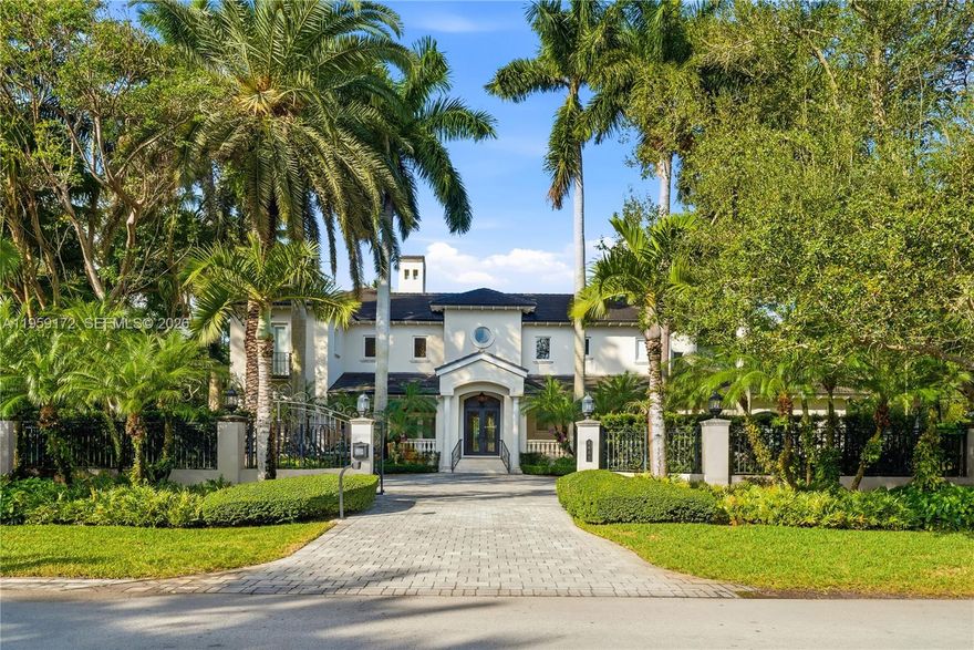 Fantastic gated corner acre-estate in Ponce-Davis with everything you could want for the active family lifestyle! Renovated in 2019, this estate includes a grandfathered lighted-tennis/pickleball court, large pool and spa area, huge family room with built-in bar, billiards room/playroom, media room, library/office, large wine vault, and detached guest house with built-in barbecue and fridge. Also staff quarters, an elevator, and a full-house generator.  Located in one of Miami's most coveted neighborhoods. Just minutes from top schools and the best that Coral Gables has to offer!