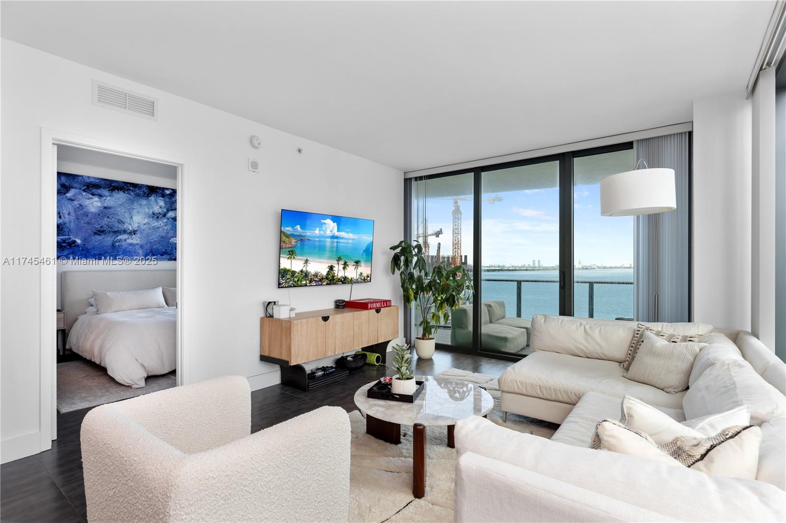 On the 8th floor of Icon Bay Miami, this 1,395 sqft 3-bed, 2.5-bath condo offers breathtaking views of Biscayne Bay and the city skyline. Enjoy stunning sunsets from your private balcony, while the modern interior features a sleek kitchen, built-in closets, and in-unit laundry. High-end appliances and spacious living areas make it perfect for entertaining. Exclusive amenities include a waterfront pool, fitness center, spa, and concierge services. Nestled in vibrant Edgewater, you're moments from Miami's top dining, shopping, and entertainment. Experience luxury living in one of Miami’s most sought-after locations!