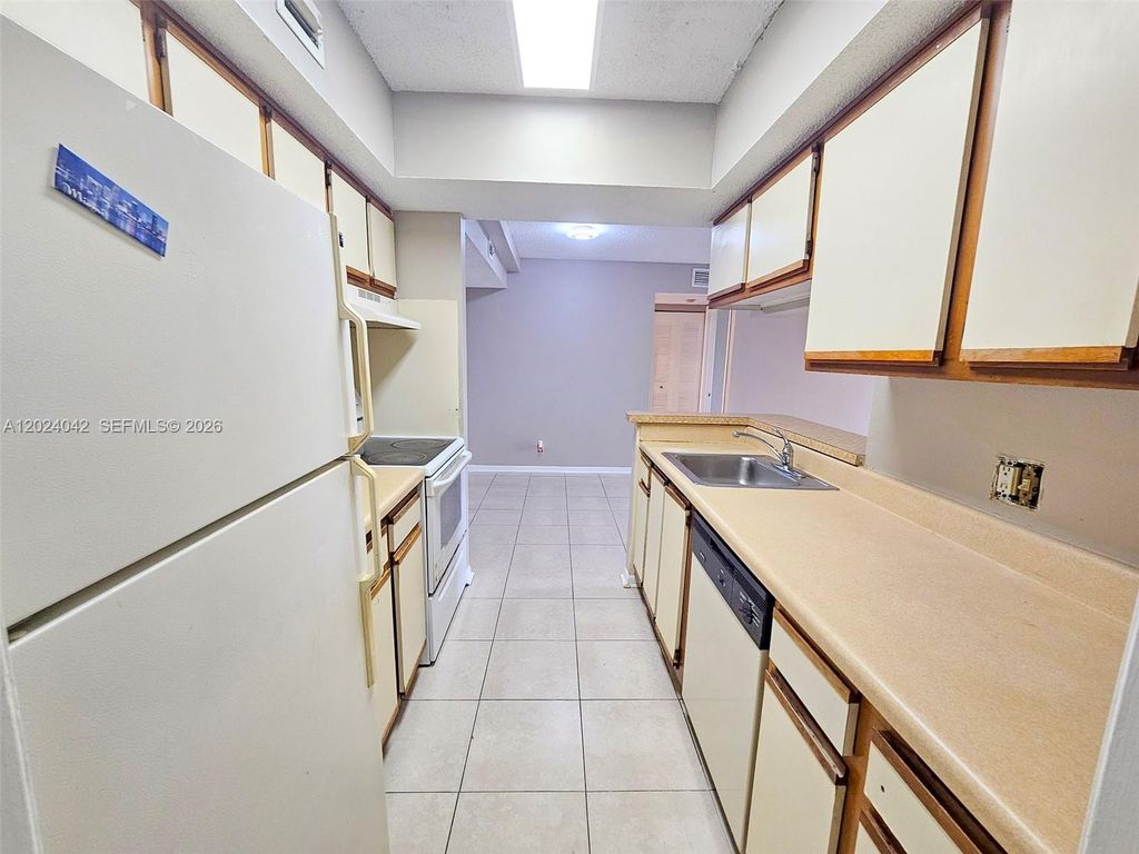 Photo of 5654 Rock Island Rd #227, Tamarac, FL 33319 (MLS # A12024042)