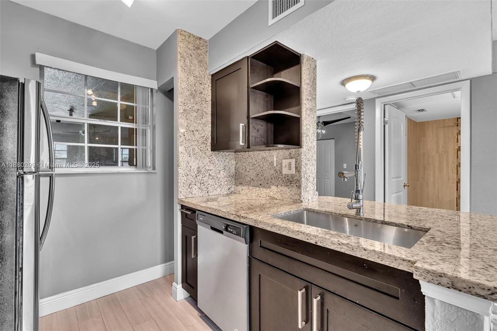 Photo of 2850 N Oakland Forest Dr #204, Oakland Park, FL 33309 (MLS # A11880299)