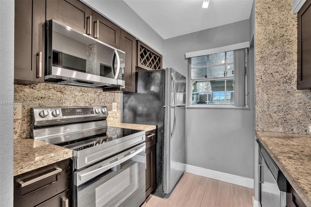 Photo of 2850 N Oakland Forest Dr #204, Oakland Park, FL 33309 (MLS # A11880299)