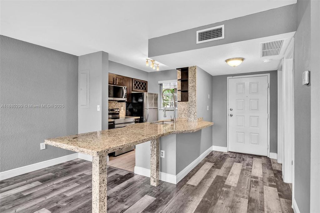 Photo of 2850 N Oakland Forest Dr #204, Oakland Park, FL 33309 (MLS # A11880299)