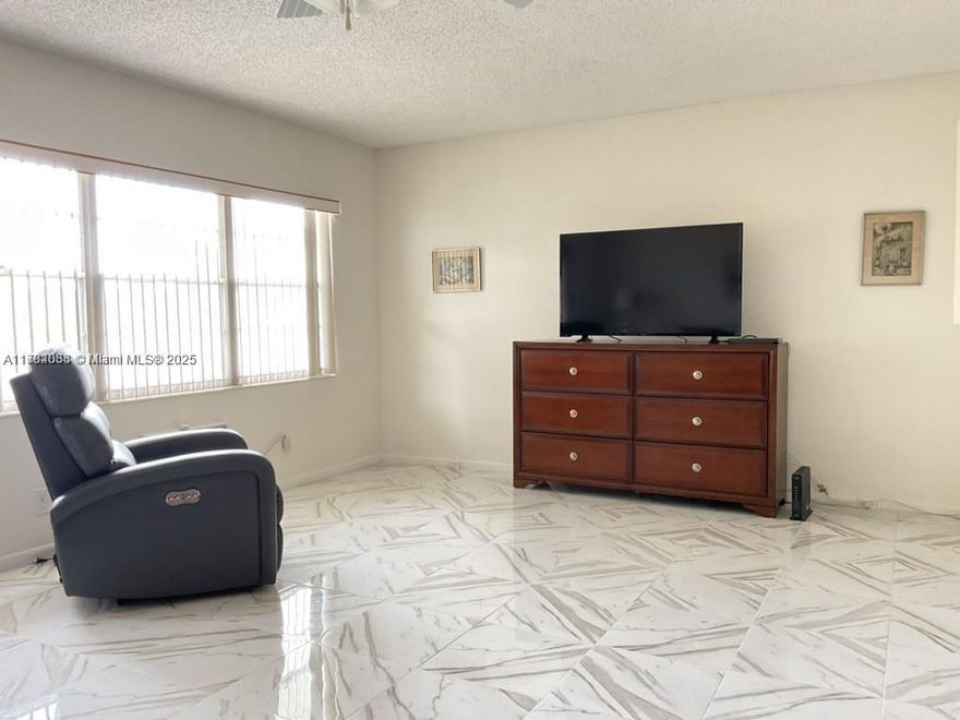 Amazing condo 1 bedroom and 1.5 baths with a long screened balcony overlooking a lake. Ceramic floors throughout the property and laminate in the bedroom. Updated kitchen and bathrooms. A designated storage room. Elevator in the building. Common laundry room on each floor. A community pool. Century Village 55 community. Amenities include: walkway throughout the complex. The Clubhouse has a full gym, theater with weekly shows and movies, pools, ping pong tables, card room, bingo, tennis courts, jacuzzi, shows, classes, clubs, library, meeting rooms, party room, fitness center, billiard room, and more. Free bus service inside the community and outside to the shops and various routes. Maintenance includes: water, cable, internet, exterior insurance, community pool. Can be rented after closing