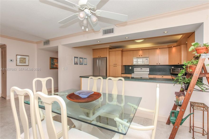 LOCATION, LOCATION, LOCATION! Step into this beautiful corner unit — the largest floor plan in the community — and enjoy stunning sunset views from your private balcony. This bright and spacious home offers an open kitchen, stainless steel appliances, and elegant ceramic tile floors throughout the living areas. The community boasts unmatched walkability with Fresh Market, restaurants, banks, and shops just steps away. Enjoy resort-style amenities including 2 tennis courts, marina, gym, billiards, ping pong, car wash area, picnic/BBQ areas, 2 heated pools, gazebo, library, and more.