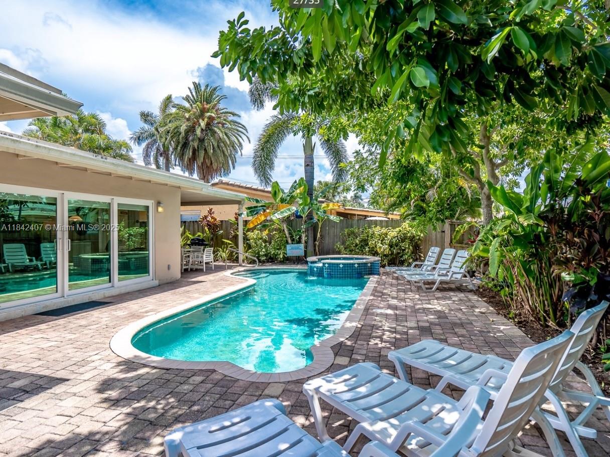 Beautiful 4 bedroom, 3 bath home with a heated pool. Currently active in the vacation rental market info available.
Close to downtown Hollywood and Hollywood Beach. This house has a lovely circular drive entrance and huge sliding impact doors going out to the pool.