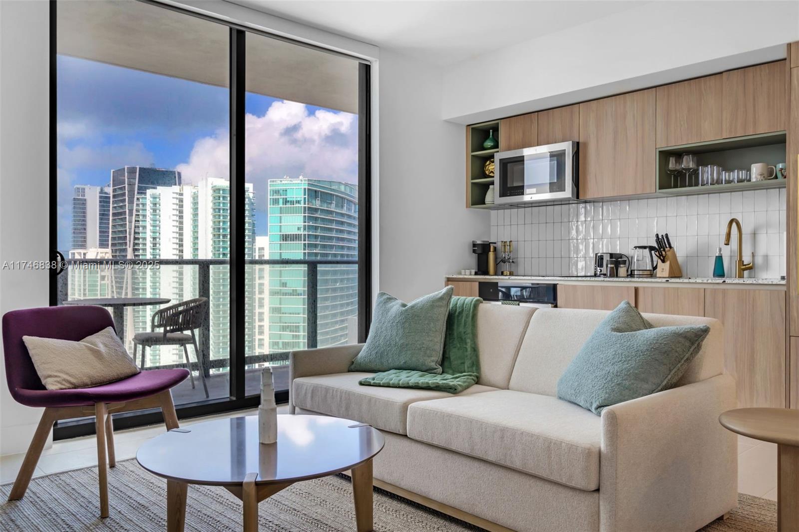 Located in the heart of Miami World Center, this brand-new, move-in-ready residence offers partial water views.
It features a spacious living area with a terrace, two full bedrooms with closets, and elegant, modern bathrooms. The fully equipped kitchen includes high-end appliances, such as a washer/dryer and dishwasher.
Everything is within walking distance—Brickell, Bayside Park, shopping centers, cruise terminals, Brightline station, Metromover, Tri-Rail station, and more.
The building offers resort-style amenities, including a stunning lobby, swimming pool, gym, and co-working spaces. Plus, it's just steps away from restaurants, bars, and coffee shops.
No rental restrictions—this property can be rented for as little as one day, making it an ideal investment opportunity.