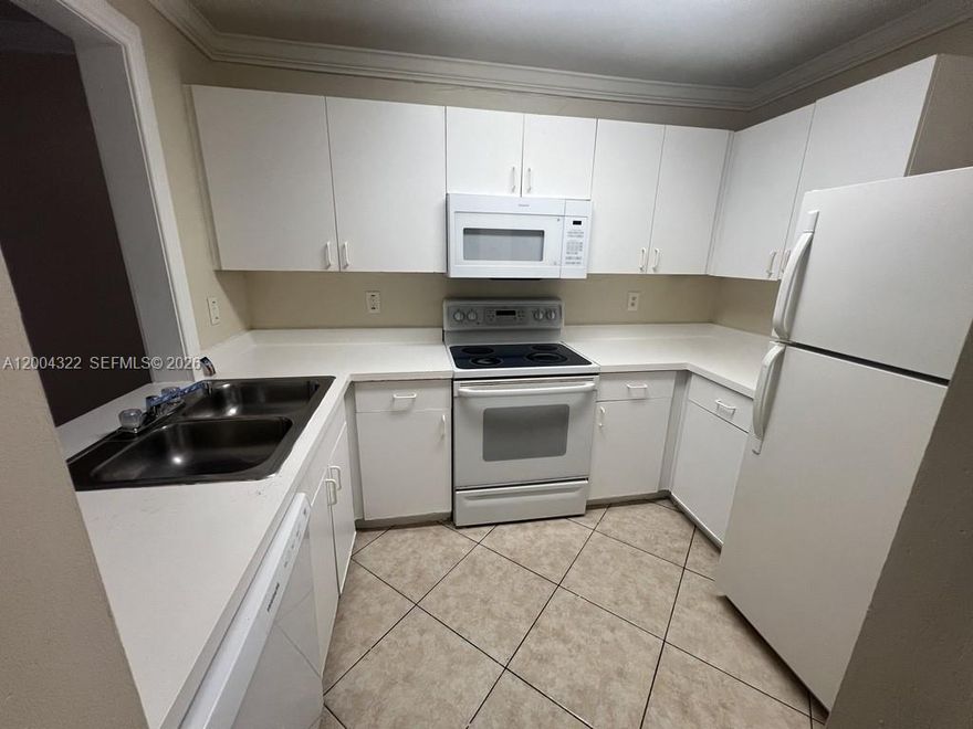 Welcome to this bright and spacious first-floor unit featuring tile flooring throughout, central A/C, and the convenience of a full-size washer and dryer inside the unit. Located in a well-maintained gated community, residents enjoy resort-style amenities including a pool, gym, and tennis courts—perfect for an active and comfortable lifestyle. Ideally situated between I-95 and the Turnpike, this home offers easy access to major roads, shopping, dining, and everyday conveniences. Water and sewer are included in the rent. One pet is allowed (maximum 25 lbs) with a $250 non-refundable pet fee to the owner and a $150 association registration fee. Association requires all adults to have a minimum 650 credit score. This is a great opportunity to live in a secure, amenity-filled community in a prime location—schedule your showing today