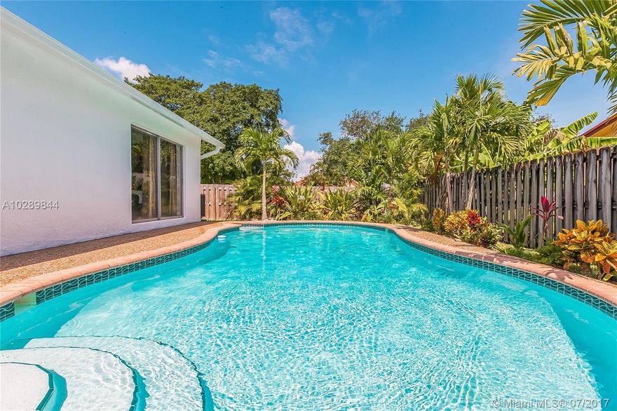 Back on the Market, Buyers financing fell thru. So, this is your chance. You will not want to miss out on this absolutely amazing 4 bedroom 2 bath pool home. Located literally steps away from 2 beautiful parks, this home offers upgrades unseen in this area. The ultra modern design offers a sea of white porcelain tiled floors, an completely open concept livingroom-dining room-kitchen area. Beautiful modern cabinets with high end granite counters. You will love the retreat style back yard with lush landscaping. SHOWINGS ARE LIMITED CALL TODAY