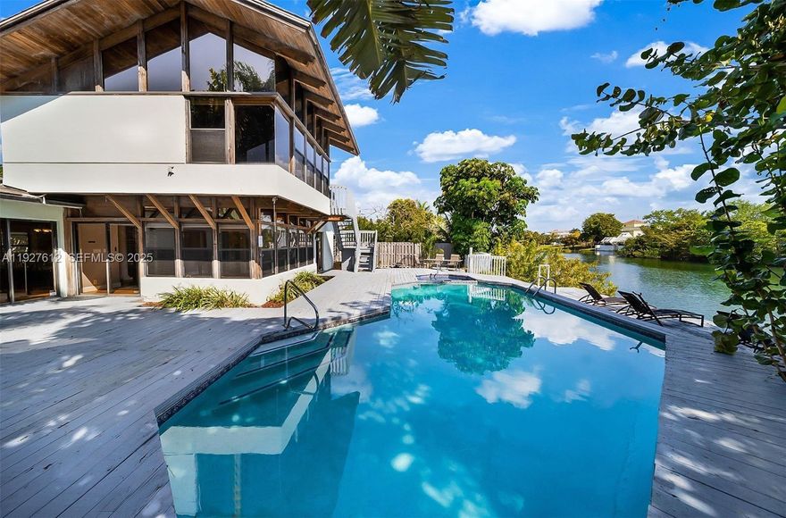 SHORT SALE - APPROVED. Needs some repairs; great rehab potential. 
This beautiful waterfront property (no ocean access) features a four-bedroom, three-and-a-half-bath home, an upstairs en suite with a separate entrance, vaulted ceilings, a cozy fireplace, a large living room, and a spacious kitchen perfect for entertaining. Three of the bedrooms have en-suite bathrooms. The backyard features a heated pool overlooking the gorgeous lake! Bring your kayak, paddleboard, and water toys to your future backyard, where every day will feel like you're living in a vacation home. The home was previously on AIRBNB with a 5-star rating (excellent for investors). Close distance to restaurants and grocery stores. Live the Florida lake house dream just 2 miles out from the beach!