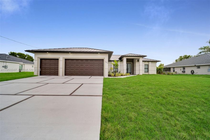 Interest Rates as Low as 4.99%. This 4-bedroom, 2-bath home offers approximately 1,800 sq ft under air with an open-concept layout. It includes impact-rated windows and doors, a 3-car garage, and a metal roof with a 50-year warranty. Inside, tile flooring runs throughout the entire home, enhancing durability and ease of maintenance. The kitchen features a waterfall quartz island and wood backsplash, complemented by high-quality cabinetry in both the kitchen and closets. The home is equipped with a whole-house reverse osmosis system, ensuring purified water at every faucet. The large sliding doors are pocket-style, creating a seamless transition between indoor and outdoor living spaces. Situated on a freshwater canal and outside any flood zone, this property offers both tranquility and convenience. Additionally, the seller is offering $10,000 toward closing costs and provides a 2-10 home warranty for added peace of mind.