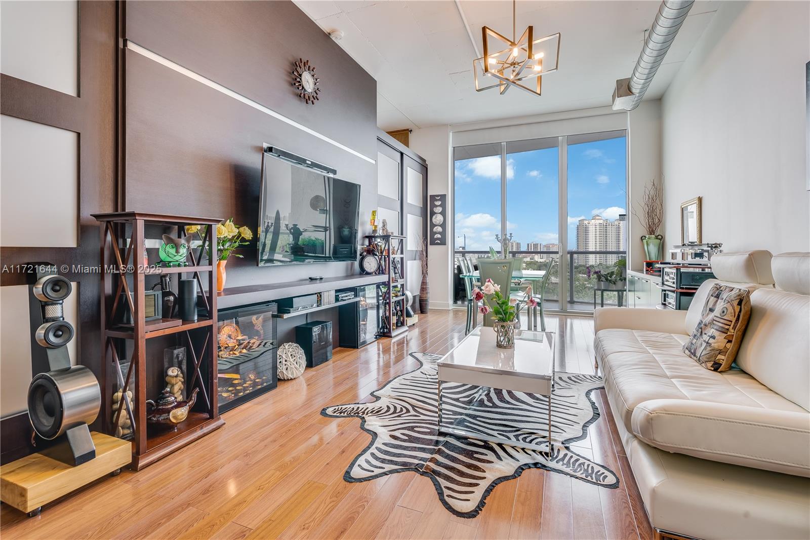 Discover this stunning loft-style unit now available in the heart of Aventura. Featuring 2 bedrooms, 2 bathrooms, and a versatile den, this property boasts: elegant wood flooring throughout, an open-concept layout, a modern kitchen with dark wood cabinetry, stainless steel appliances, a kitchen island, and a washer and dryer. The industrial-style 11-foot ceilings, floor-to-ceiling hurricane-impact sliding glass doors, and a spacious balcony overlooking the water add a unique charm.
Enjoy a wealth of amenities, including a breathtaking 3-mile exercise trail. Conveniently located within walking distance of Aventura Mall, top-rated restaurants, and just minutes away from the beaches, major highways, and the airport. This property offers the perfect blend of luxury and convenience—don’t miss!