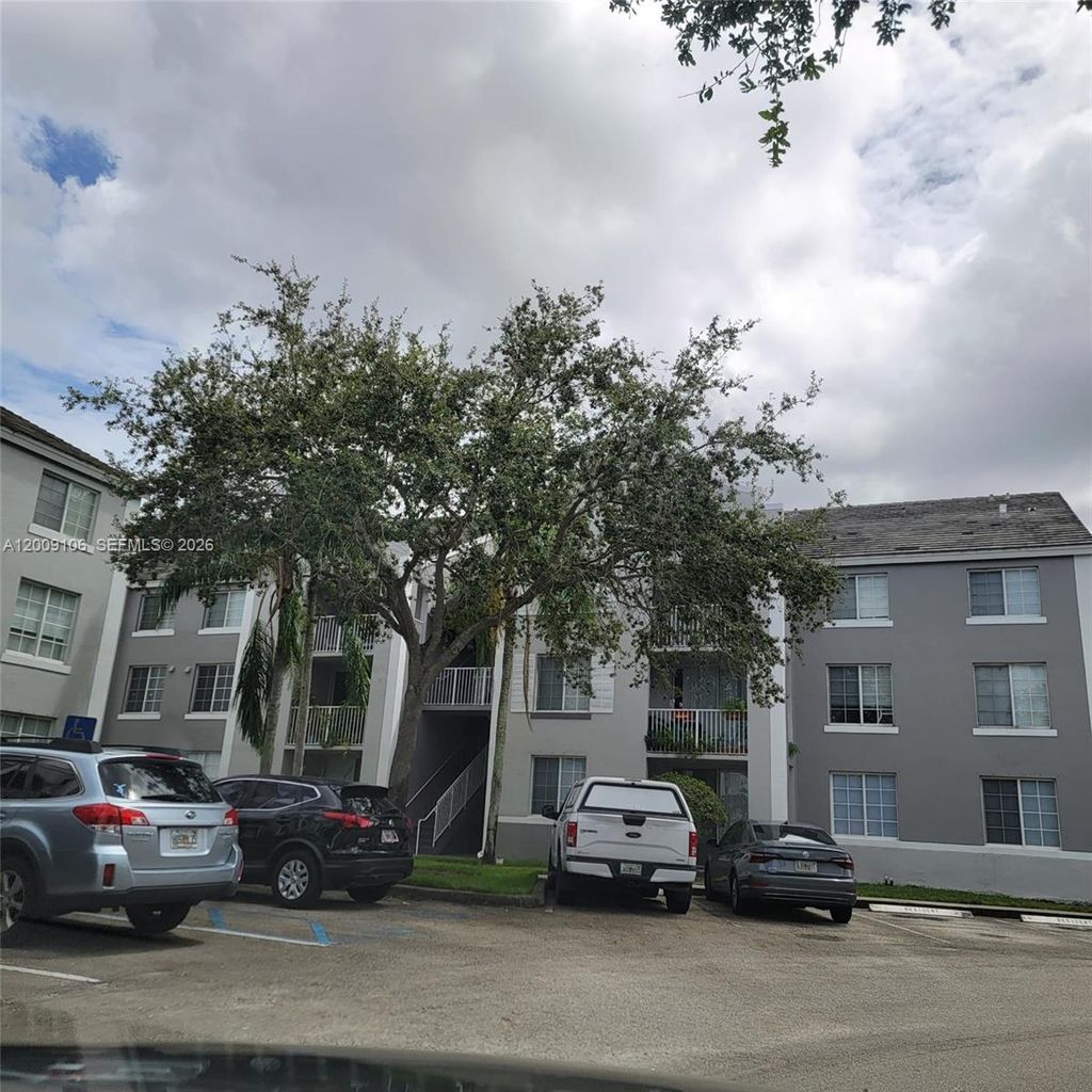Photo of 711 SW 111th Way #301, Pembroke Pines, FL 33025 (MLS # A12009106)