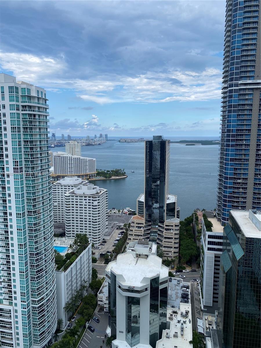 Experience the luxury at its best in this high floor unit, features 2bedrooms/3 bathrooms+Den with amazing bay views.The unit features Italian flooring ,chef's kitchen with European appliances and large terrace.This luxury building has 2 floors of amenities including a rooftop pool, outdoor theater, squash court, indoor basketball racquet ball court, spa featuring co-ed hammam, fitness center with double-height ceiling, an outdoor track, an arcade with a golf simulator, and more. Conveniently In the heart of Brickell ,walking distance to all the great restaurants and shopping. The unit has one unassigned parking