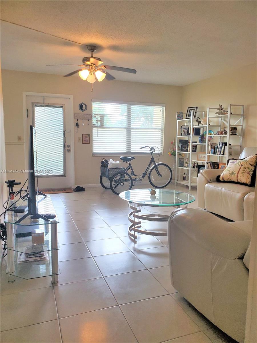 This beautiful apartment 2/1.5 in Century Village, an active 55+ community has tile floor thorough, full of light and very spacious. Remodeled kitchen and bathroom. Conveniently located on the 1st floor, with a wonderful garden view. Close to the tennis courts.