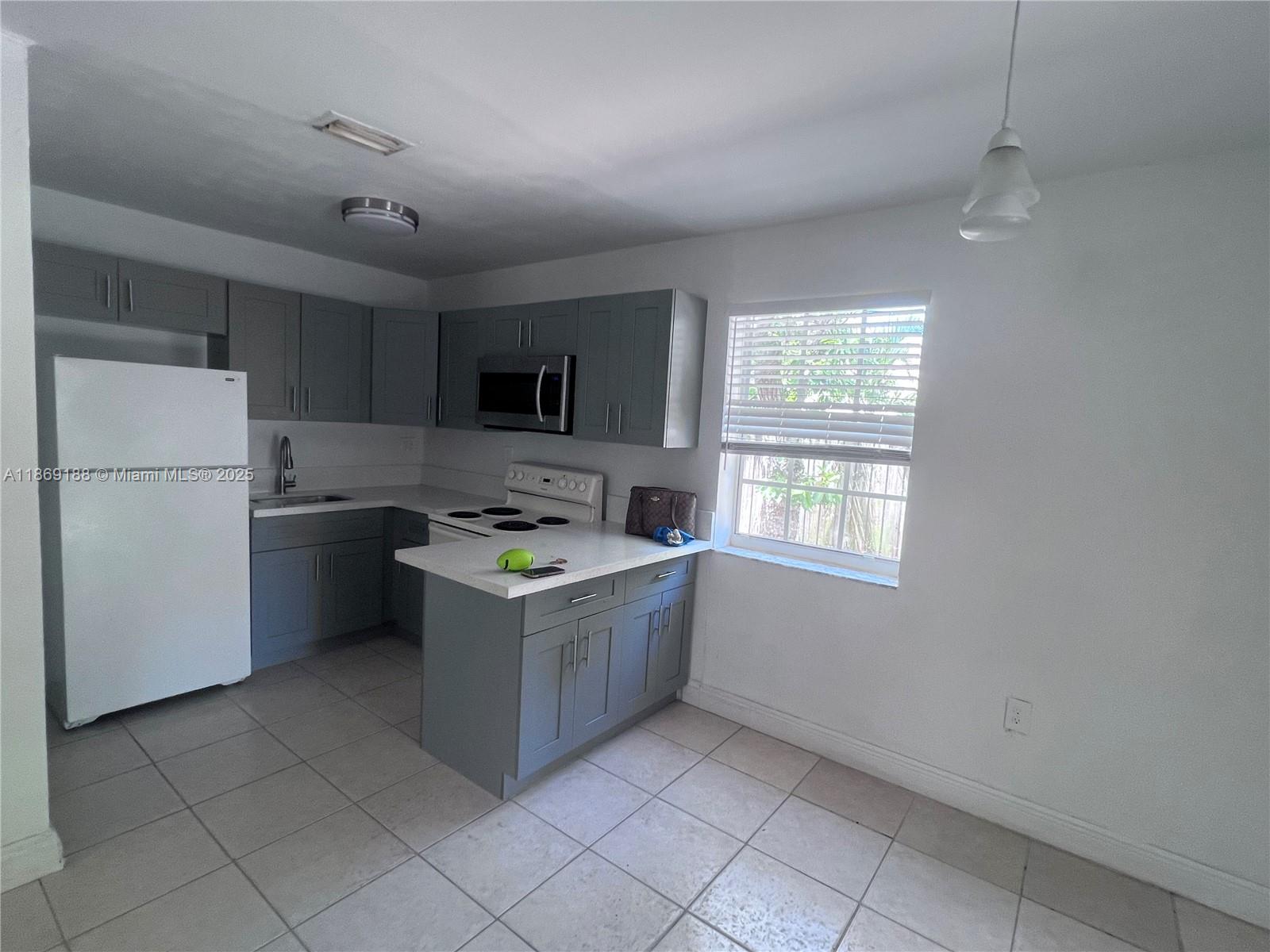 Charming 3-bedroom, 1-bath home featuring a beautifully remodeled kitchen, spacious backyard, and convenient in-unit washer & dryer. Prime location with easy access to I-95, just minutes from Miami Beach, Downtown, Hialeah, and Broward. Perfect for comfortable living and enjoying all that South Florida has to offer!Section 8 Welcome!!