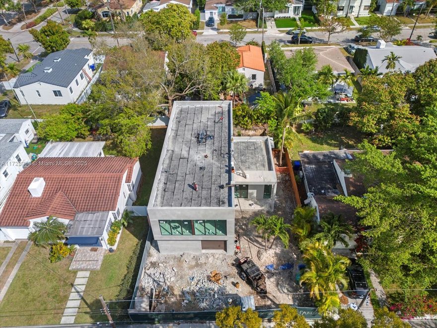 3,704 sqft New Two-story Single Family Home in Prime location (Quiet street in the desirable The Roads area), 5 minutes away from Metropolitan Brickell, and 10 mins away from Coconut Grove! Brand new construction with an open floor plan, Double-door entry, 5 beds, 4.5 baths. Open floorplan with Dining & Great Rooms. Features a modern design, natural light in all rooms, Master bath with Free-standing Tub & Large Shower, high-end finishes, modern appliances with double oven and double large refrigerators, Custom-Designed European Kitchen (up to the ceiling), Calacatta quartz countertop with waterfall, walk-in pantry, 10" ceiling height, all doors are 8' height. Spacious bedrooms (one in-suite bed on the 1st floor), pool, covered terrace w/ summer kitchen. Ready to deliver in June 2025