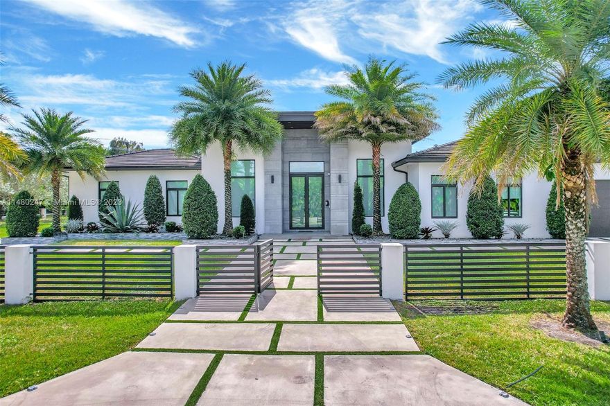 Indulge in luxury in this contemporary Davie estate, near top schools, organic markets, and restaurants, with easy highway access. This 6-bed, 6.5-bath home boasts porcelain floors, high ceilings, and a European kitchen. Elegant 8 ft Italian doors, modern faucets, and lighting enhance the ambiance.Built in 2019, this Davie sanctuary features resort-style high ceilings, custom closets, and a 3-car garage. The focal point is the European-styled chef kitchen with Bosch appliances.Exploring possibilities with plans for a 2,000SQFT extension on the 3-car garage—a canvas for personalized gatherings.Explore attractions like the Hard Rock Cafe, Hollywood boardwalk, and beaches, all while enjoying the convenience of being close to highways and the airport.