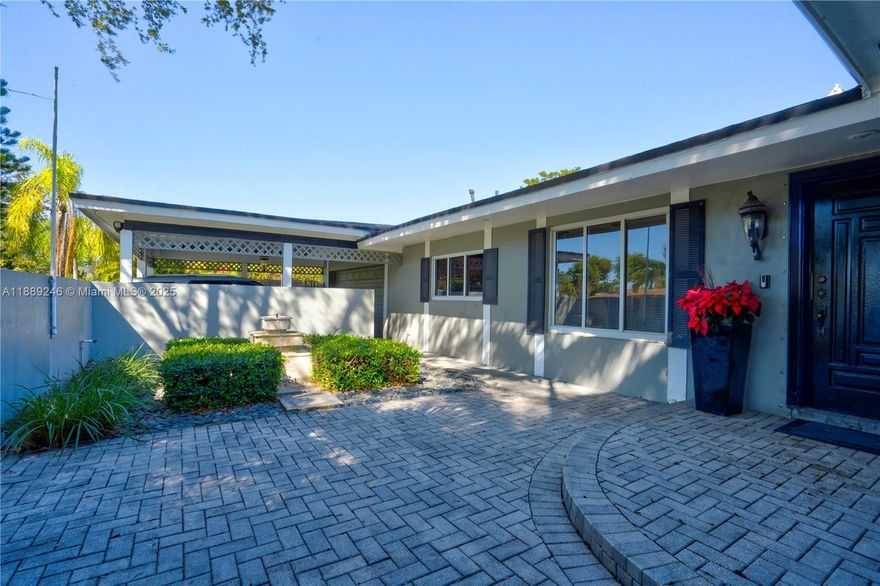 The perfect home at Pine Shores. 3,031 Total square feet home, remodeled with newer roof, A/C system, open kitchen. Beautiful custom courtyard with fountain make the entry a perfect welcome. Amazing space inside with large living room and family room. Fourth bedroom can be a library or in law quarters as it has separate entrance and is located on other side of home. The lot is larger than average and totally gated with mature trees. 
Wonderful wrap around terrace with various sitting areas. Property is located in top rated public schools area and only minutes from the Falls Shopping Center.