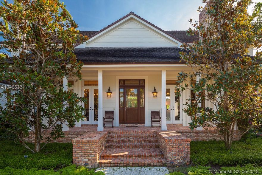 Extraordinary detail, timeless style & magnificent millwork define this breathtaking Old Cutler Bay masterpiece. Boasting front/back water views, the stately David Johnson/Phyllis Taylor collaboration is fresh, fabulous & built for the ages. Its classic coastal design draws on Old Florida architecture. No-expense-spared coffered ceilings, 15" baseboards, dbl-deep walls/window casements, soaring doors/halls, planked walnut floors & top-tier appliances. The very embodiment of understated wealth & restraint. Gourmet kitchen; formal living & dining rms; family, library & play rms, ethereal master; ensuite bdrms & staff quarters. Resort-style outdoor living; infinity pool, 120-ft concrete dock w/lift; direct bay access.A rare listing of inordinate caliber in highly sought, gated Old Cutler Bay.