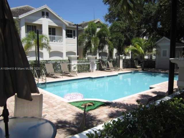 Rarely available corner townhome in gated Oak Hammock! This spacious 3-bed, 2.5-bath unit features high ceilings, kitchen with granite counters, and a freshly painted interior. All bedrooms are upstairs and the laundry room. Enjoy a private, fenced backyard from the living room's French doors. The large master suite includes a sunny balcony and huge walking closet. With a 2-car garage and community pool, it's perfectly located minutes from the airport, Port Everglades, and minutes from downtown Las Olas where you will find shopping, dining, entertainment, nightlife and more. Easy to see and fast to move in.
